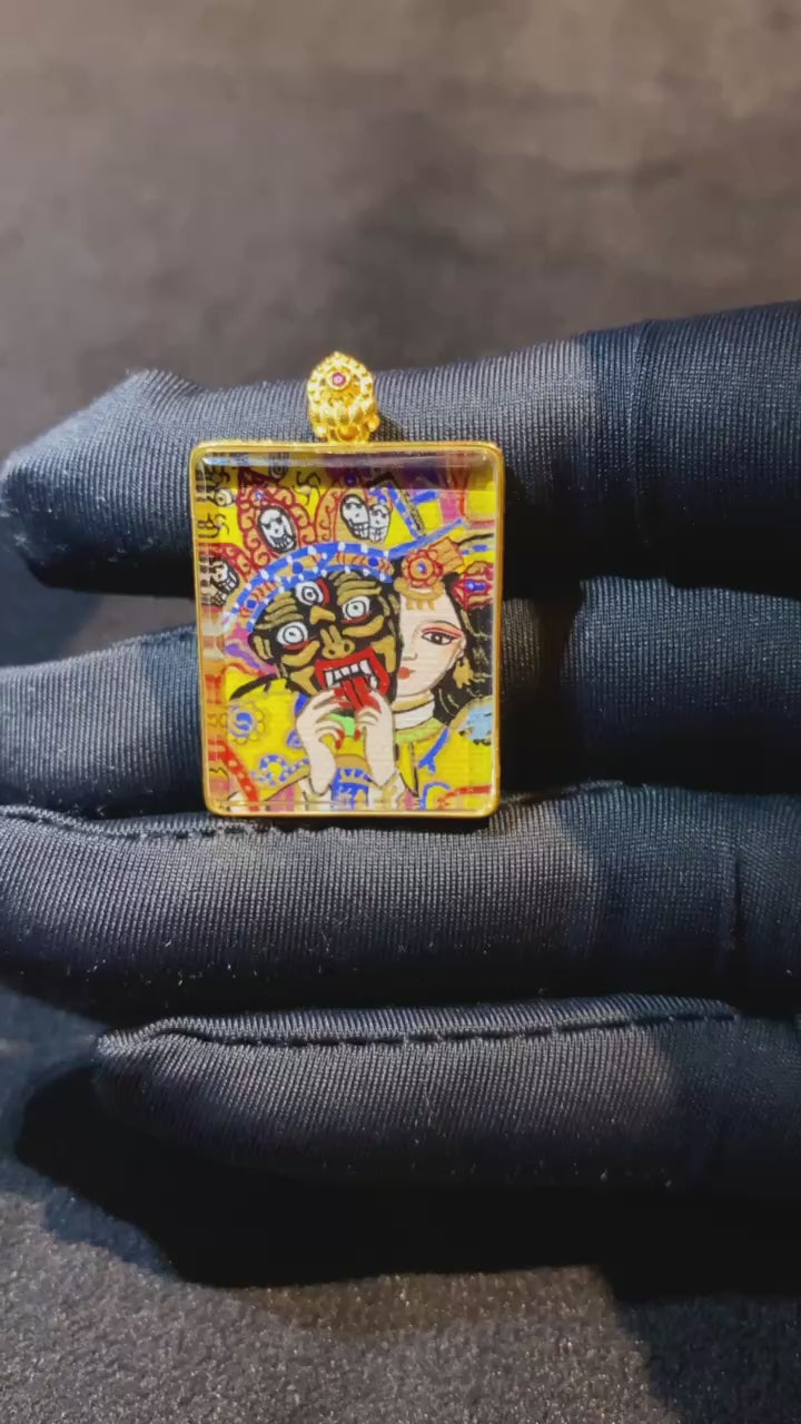 Video showcasing a double-sided Tibetan Ghau Thangka pendant with Zaki Lham and Five Sacred Inscriptions, hand-painted in 18K gold using Rebgong Thangka craftsmanship with sapphire glass protection