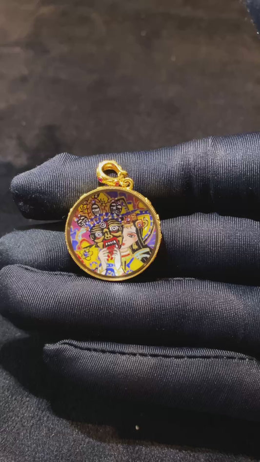 Video showcasing a double-sided Tibetan Ghau Thangka pendant with Zaki Lham and Zaki mantra seed syllable, hand-painted in 18K gold with Rebgong Thangka craftsmanship and sapphire glass protection