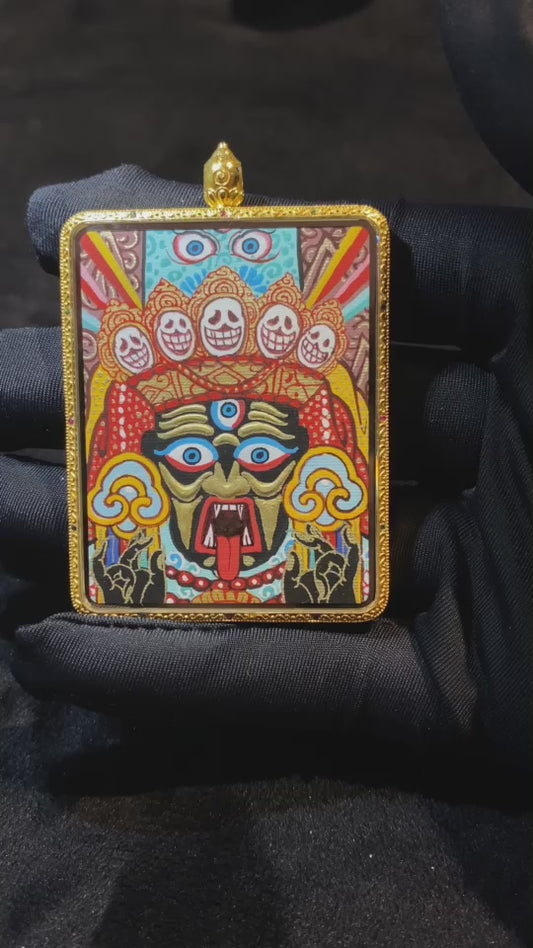 Close-up video of a large double-sided Tibetan Thangka pendant featuring Zaki Lhamo and Mahakala, fully hand-painted in 18K gold with full-detail Rebgong craftsmanship, set in a sapphire crystal Gawu box