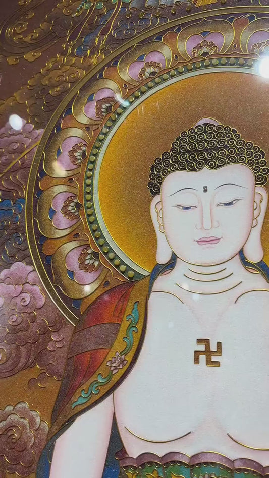 A video presentation of a Shakyamuni Buddha gemstone thangka hand-painted in the Rebgong tradition, showcasing mineral pigments, detailed craftsmanship, and a calm contemplative presence.