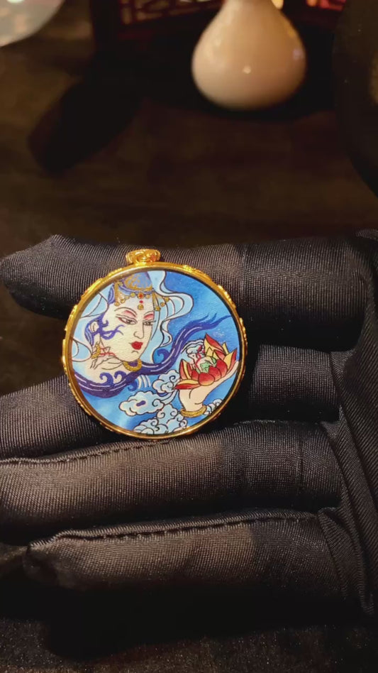 video of Water Moon Guanyin Gau pendant, dual-sided and hand-painted with 18K gold in the Rebgong Tibetan tradition

