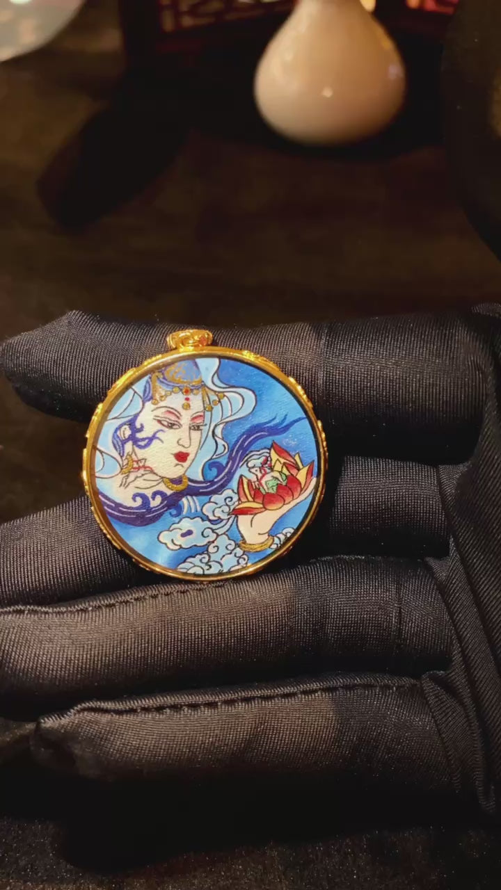 video of Water Moon Guanyin Gau pendant, dual-sided and hand-painted with 18K gold in the Rebgong Tibetan tradition

