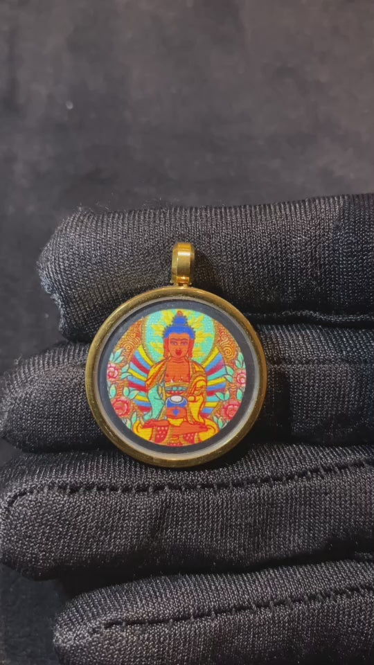 Video showing hand-painted gold-outlined Tibetan thangka pendants in 29mm titanium steel gau boxes, designed for wholesale and bulk distribution