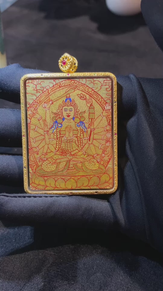 Video showcasing a Cundi Bodhisattva and Guru Rinpoche thangka pendant, fully hand-painted with 18K gold on both sides, Rebgong Tibetan art, sapphire crystal Gawu box, front and back details