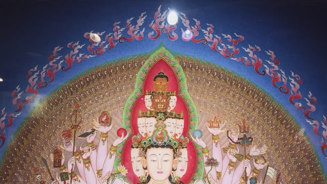 Video showcasing a large Rebgong gemstone pigment thangka of Thousand-Armed, Thousand-Eyed Avalokiteshvara, hand-painted in the Himalayan tradition with natural mineral pigments and presented in a pear wood frame