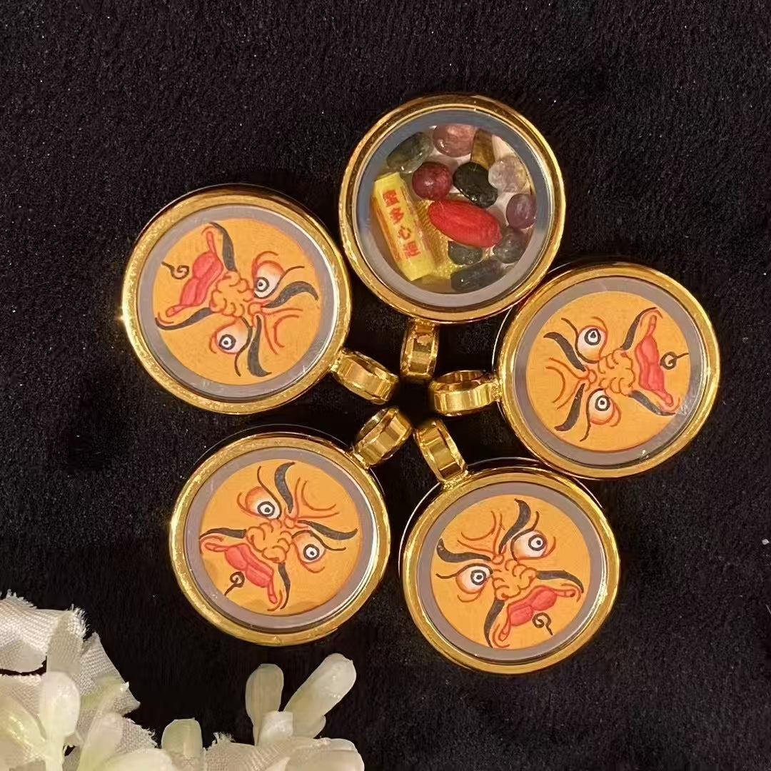 Back view of hand-painted Yellow Jambhala Tibetan Gawu pendant featuring traditional sacred motif