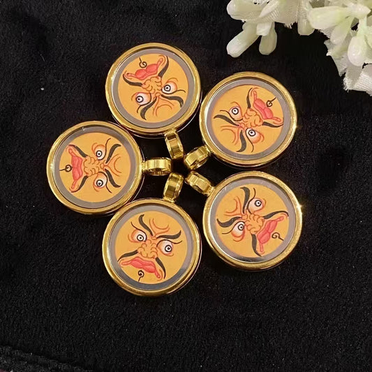 Hand-painted Yellow Jambhala Thangka set in a titanium steel Tibetan Gawu pendant, compact wealth deity amulet